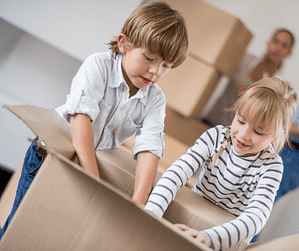 Kids playing with a box while moving